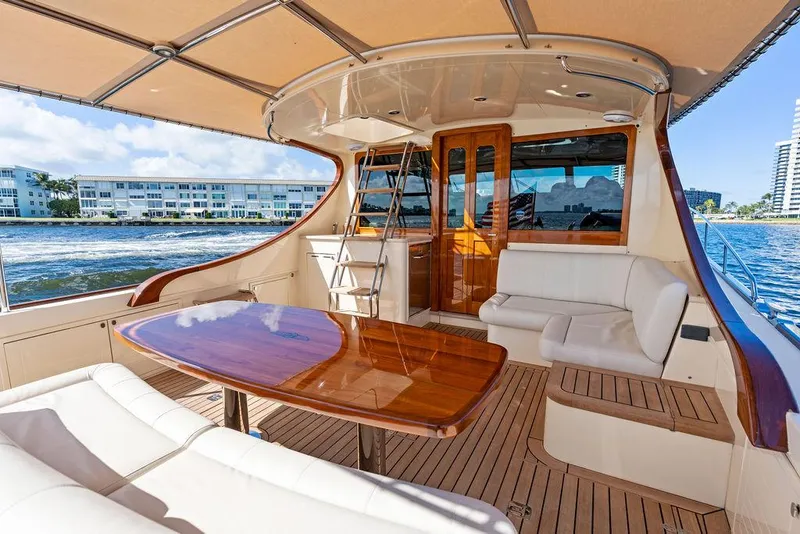 Slide: The Image of 2018 Palm Beach Motor Yachts PB55 Flybridge with elegant teak deck and luxurious seating. - 17