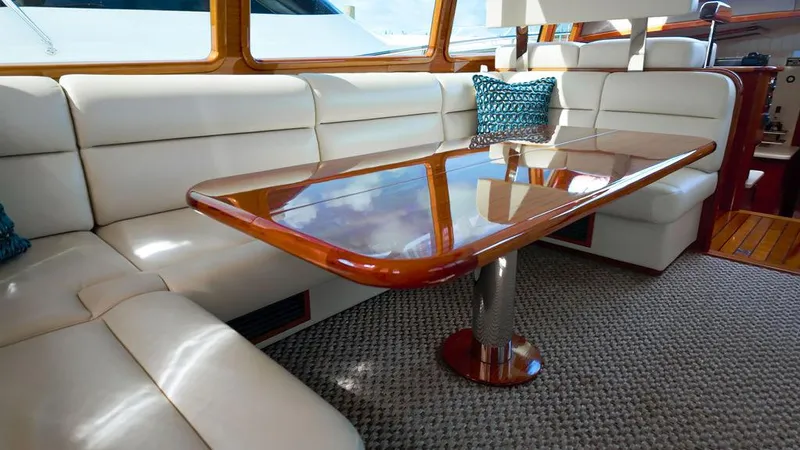 Slide: The Image of Luxurious interior of 2018 Palm Beach Motor Yachts PB55 Flybridge with elegant seating and wooden table. - 32