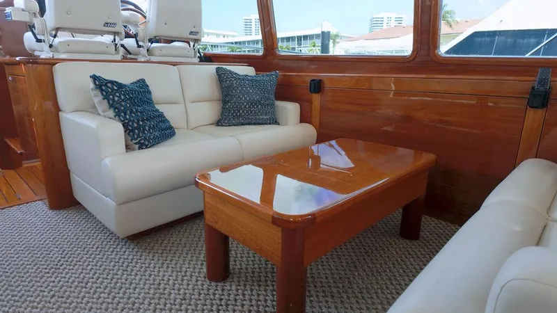 Slide: The Image of Luxurious interior of 2018 Palm Beach Motor Yachts PB55 Flybridge with elegant seating and wooden table. - 34