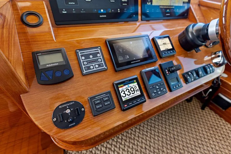 Slide: The Image of Control panel of 2018 Palm Beach Motor Yachts PB55 Flybridge with navigation instruments. - 40