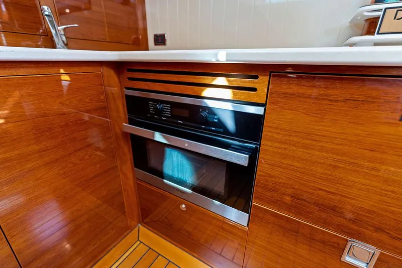 Slide: The Image of Modern kitchen in 2018 Palm Beach Motor Yachts PB55 Flybridge with built-in oven. - 46