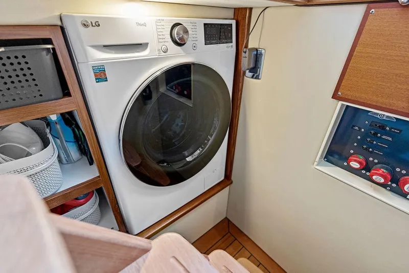 Slide: The Image of Laundry area in 2018 Palm Beach Motor Yachts PB55 Flybridge with LG washer. - 49