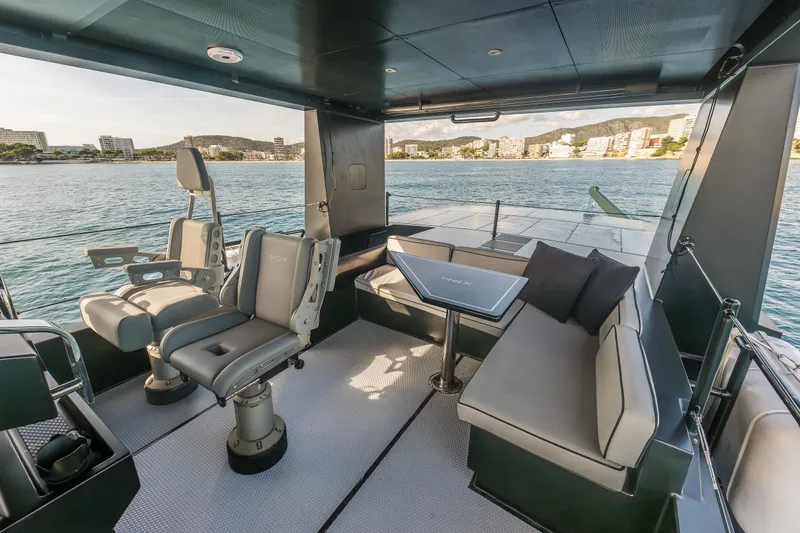 Slide: The Image of Luxurious 2023 Naval Yachts XPM 78 interior with seating and scenic ocean view. - 24