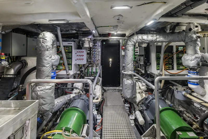 Slide: The Image of Engine room of 2023 Naval Yachts XPM 78, showcasing advanced machinery and piping systems. - 29