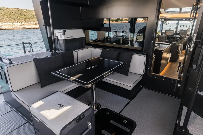 Slide: The Image of Luxurious 2023 Naval Yachts XPM 78 interior with modern seating and scenic ocean view. - 6