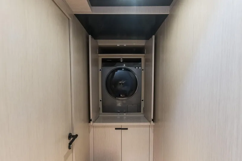 Slide: The Image of Laundry area with washing machine on 2023 Naval Yachts XPM 78. - 15