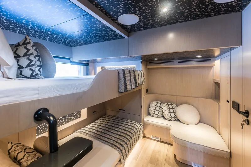 Slide: The Image of Luxurious interior of 2023 Naval Yachts XPM 78 with cozy bunk beds and seating area. - 19