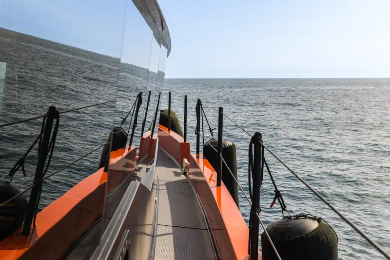 Slide: The Image of Naval Yachts XPM 78, 2023 model, cruising on open sea with clear skies. - 22