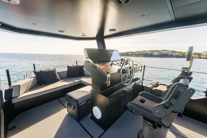 Slide: The Image of Luxurious 2023 Naval Yachts XPM 78 helm with seating, overlooking serene ocean view. - 23