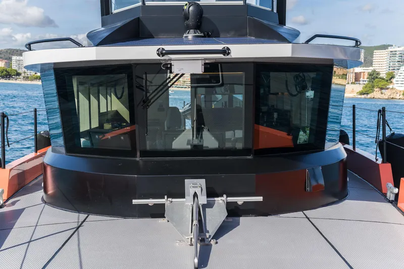 Slide: The Image of 2023 Naval Yachts XPM 78 yacht, featuring sleek design and modern windows, docked by the sea. - 25