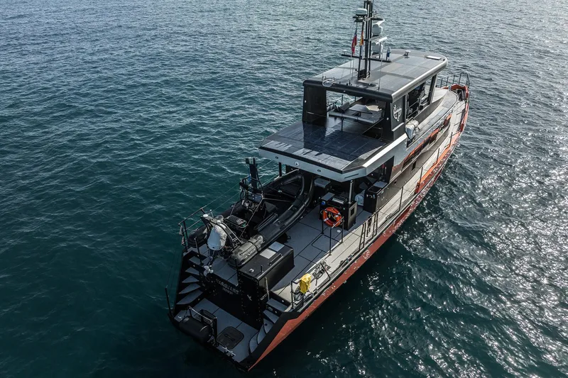 Slide: The Image of 2023 Naval Yachts XPM 78 cruising on open water, aerial view. - 3