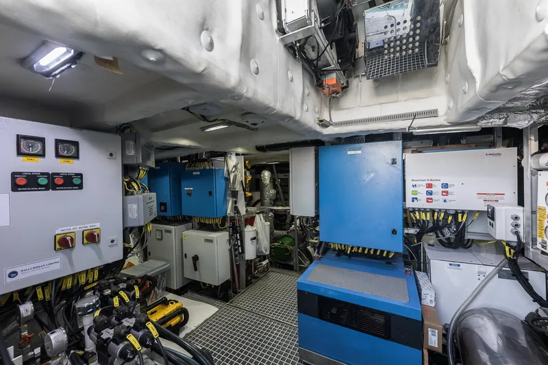 Slide: The Image of Engine room of 2023 Naval Yachts XPM 78, featuring advanced control panels and equipment. - 32