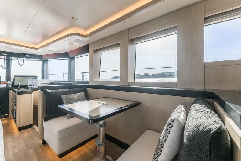 Slide: The Image of Luxurious interior of 2023 Naval Yachts XPM 78 with modern seating and panoramic windows. - 9