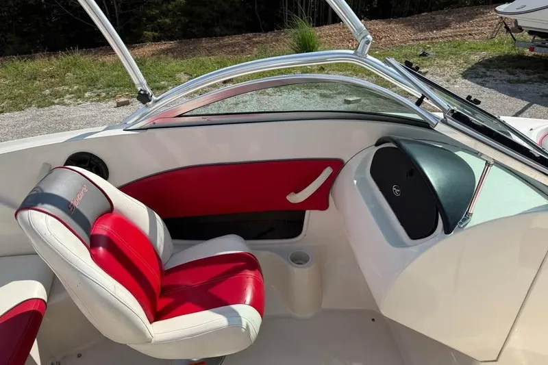 Slide: The Image of 2006 Sea Ray 195 Sport boat interior with red and white seating, sleek design. - 11