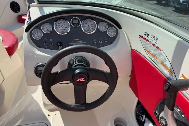 Slide: The Image of 2006 Sea Ray 195 Sport boat dashboard with steering wheel and instrument panel. - 9