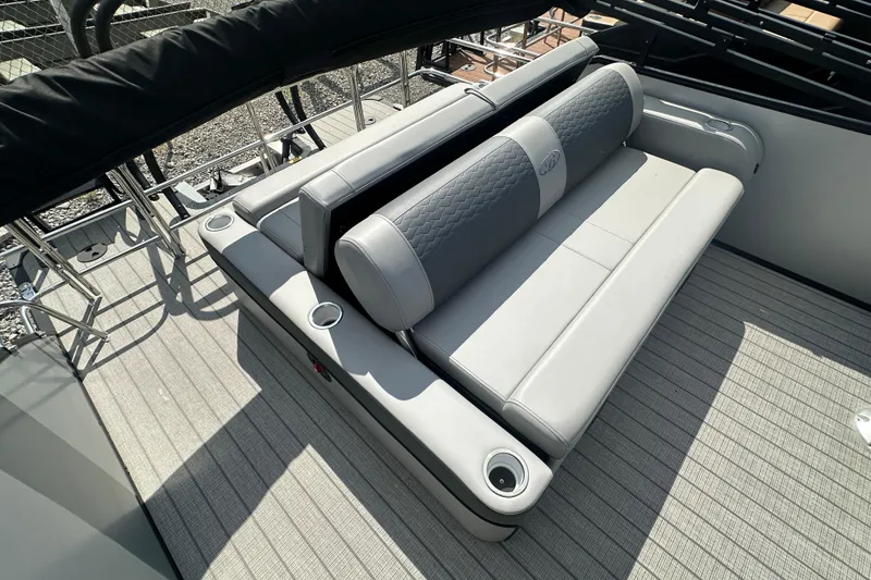 Slide: The Image of 2025 Bentley Pontoons 223 Elite Swingback with luxurious gray seating and cup holders. - 11
