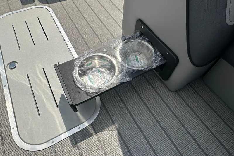 Slide: The Image of 2025 Bentley Pontoons 223 Elite Swingback with retractable cup holders on deck. - 13