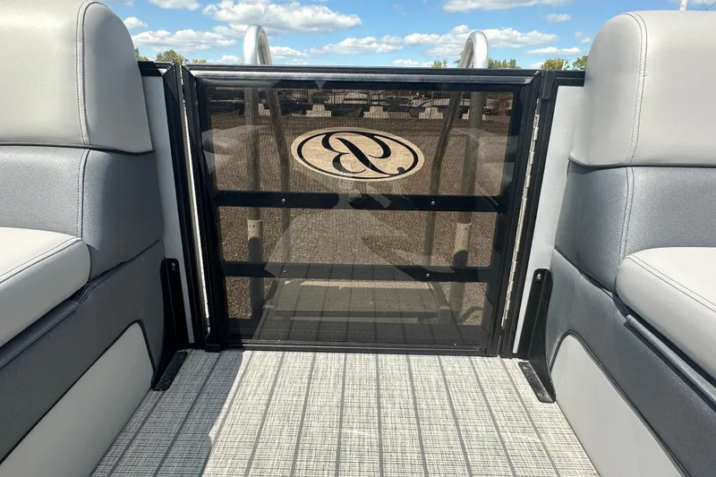 Slide: The Image of 2025 Bentley Pontoons 223 Elite Swingback interior with stylish seating and logo detail. - 16