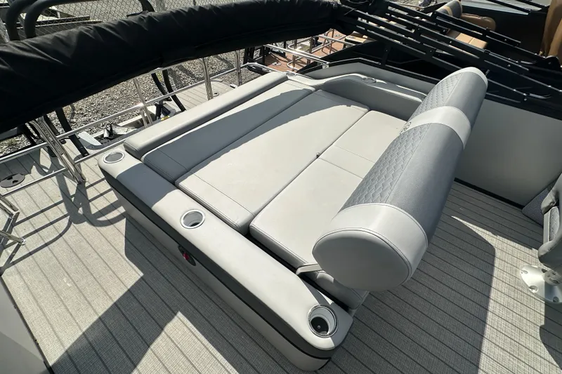 Slide: The Image of 2025 Bentley Pontoons 223 Elite Swingback with luxurious seating and cup holders. - 19
