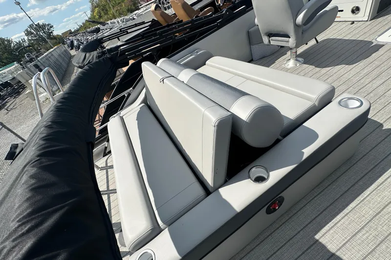 Slide: The Image of 2025 Bentley Pontoons 223 Elite Swingback with luxurious seating and cup holders. - 23