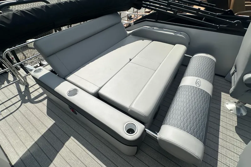 Slide: The Image of 2025 Bentley Pontoons 223 Elite Swingback with luxurious gray seating and cup holders. - 9
