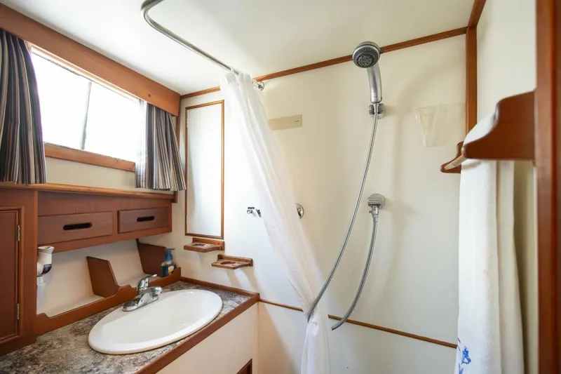 Slide: The Image of Bathroom interior of 1985 Grand Banks 42 Classic yacht, featuring shower and sink. - 18
