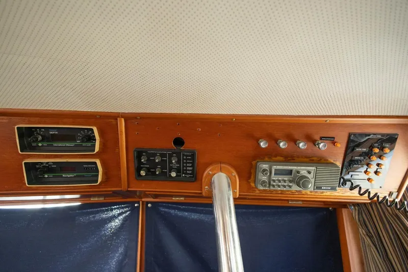 Slide: The Image of Control panel of a 1985 Grand Banks 42 Classic yacht with navigation instruments. - 21
