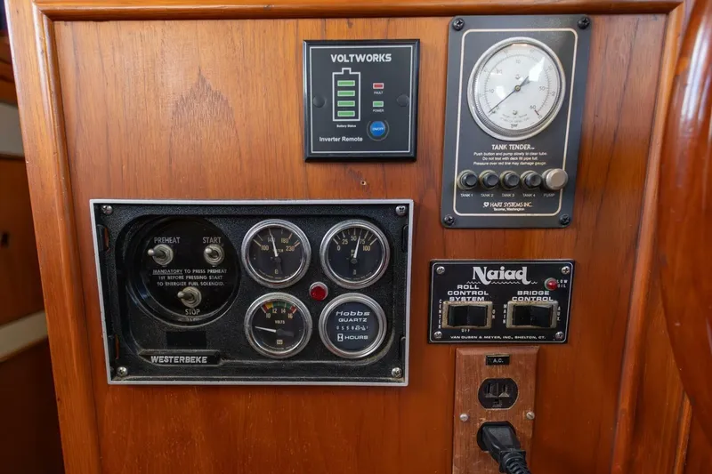 Slide: The Image of Control panel of a 1985 Grand Banks 42 Classic yacht with gauges and switches. - 22