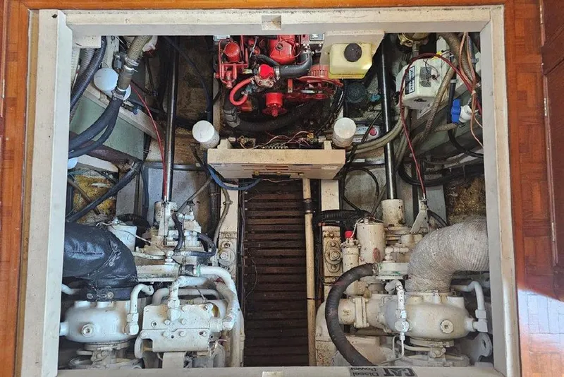 Slide: The Image of Engine room of a 1985 Grand Banks 42 Classic yacht, showcasing mechanical components. - 32