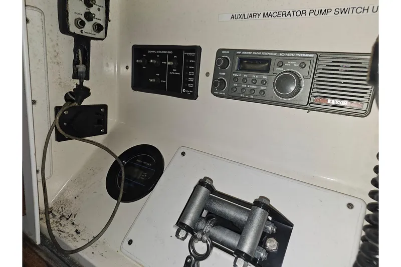 Slide: The Image of Control panel of a 1985 Grand Banks 42 Classic boat with radio and switches. - 42