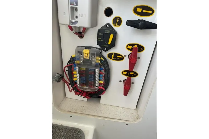 Slide: The Image of Electrical panel of 2019 Beneteau Antares 23 boat with fuses and switches. - 12