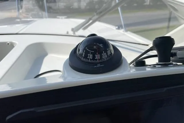 Slide: The Image of Compass on 2019 Beneteau Antares 23 boat dashboard, close-up view. - 17