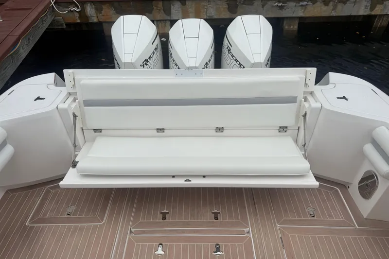 Slide: The Image of 2021 Intrepid 409 Valor boat docked, featuring sleek design and modern amenities. - 10