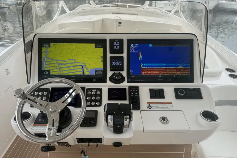Slide: The Image of Helm of 2021 Intrepid 409 Valor with advanced navigation displays and controls. - 18