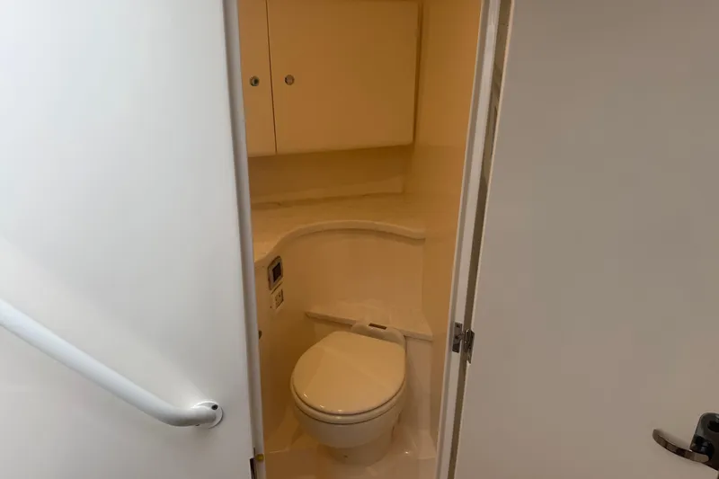 Slide: The Image of Interior of 2021 Intrepid 409 Valor boat with wooden steps and cabin area. - 29