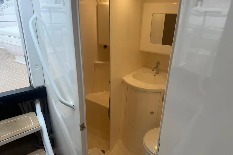 Slide: The Image of 2021 Intrepid 409 Valor boat interior bathroom with sink and mirror. - 35