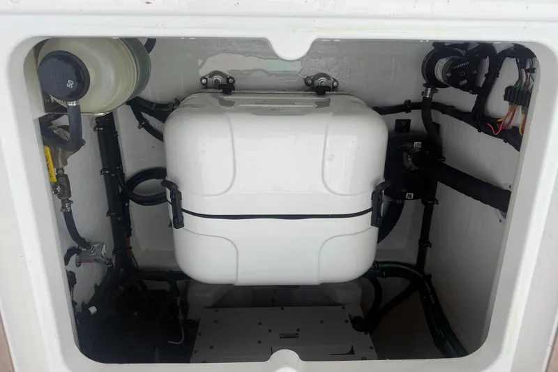 Slide: The Image of Engine compartment of a 2021 Intrepid 409 Valor boat, showcasing mechanical components. - 37