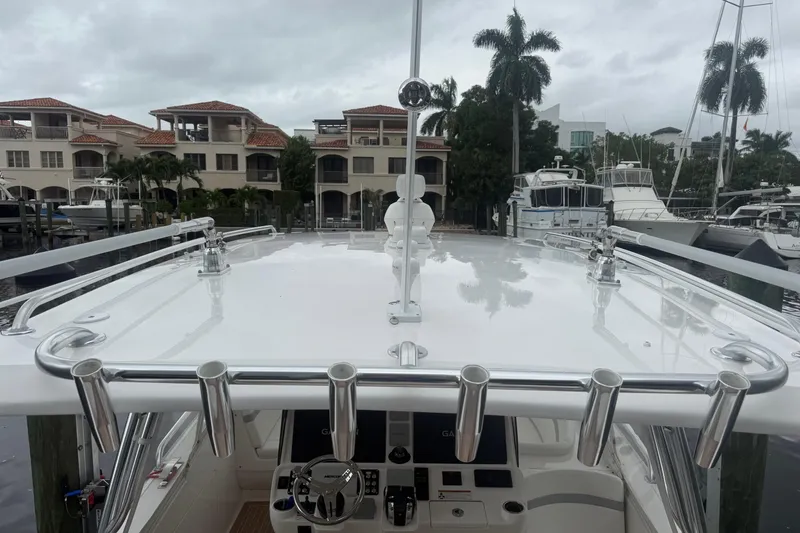 Slide: The Image of 2021 Intrepid 409 Valor boat on calm water, side view. - 4