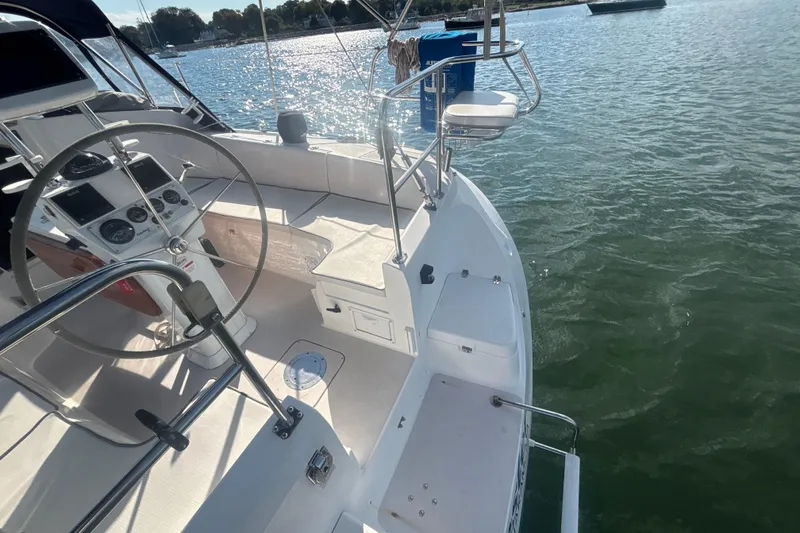Slide: The Image of Cockpit view of a 2004 Catalina 350 sailboat on calm waters. - 34