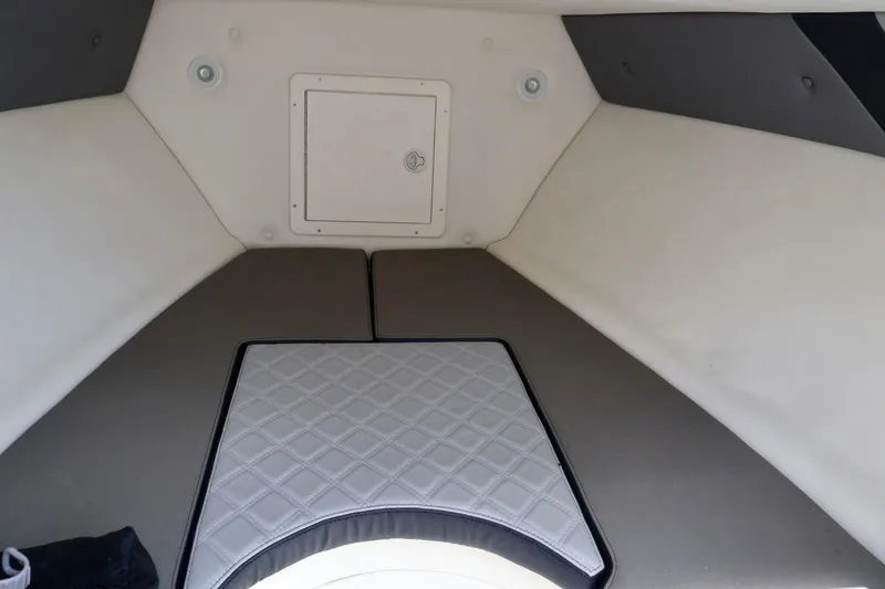 Slide: The Image of Interior cabin of 2008 Renegade 29CC boat with cushioned seating. - 10