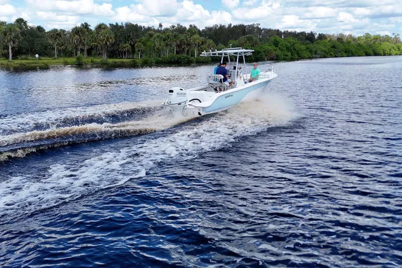 Slide: The Image of 2009 Sea Fox 230 Center Console boat cruising on a scenic river. - 6
