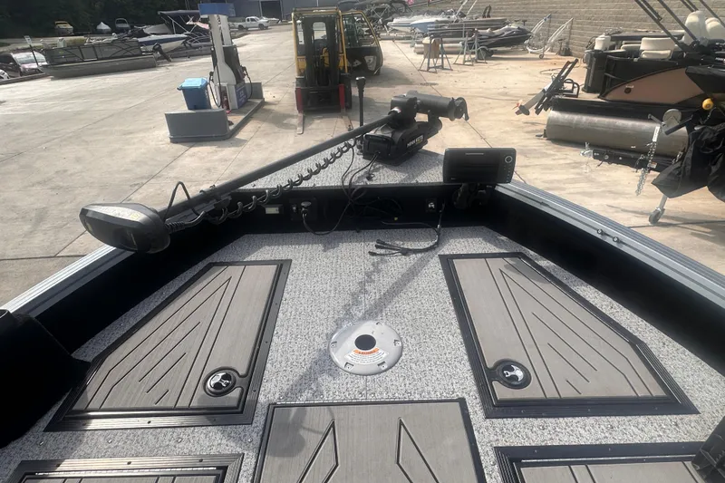 Slide: The Image of 2025 Starcraft Delta 188 DC Pro boat deck with advanced fishing equipment and storage compartments. - 20