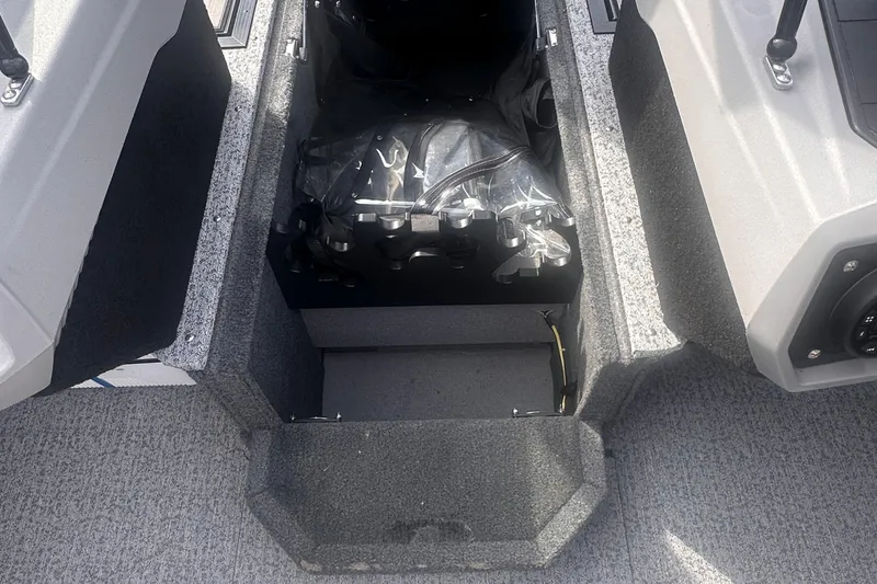 Slide: The Image of Storage compartment in 2025 Starcraft Delta 188 DC Pro boat, featuring organized interior space. - 21