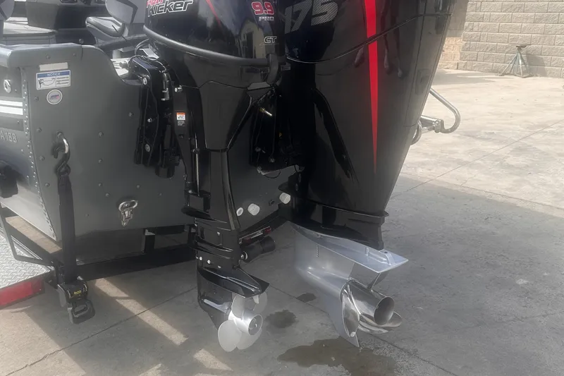 Slide: The Image of Outboard motors on a 2025 Starcraft Delta 188 DC Pro boat, parked on concrete. - 28