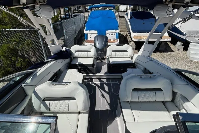 Slide: The Image of 2023 Regal LX4 boat interior with luxurious seating and modern design. - 9