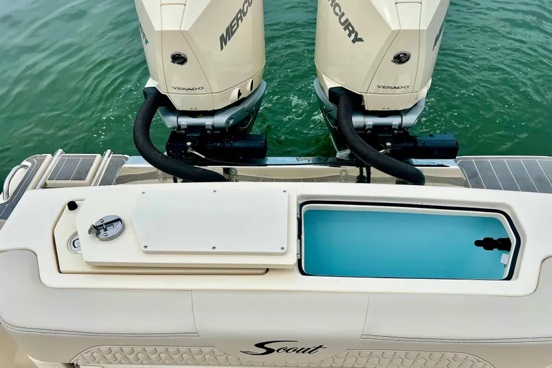 Slide: The Image of 2026 Scout 288 LXF boat with dual Mercury Verado engines on water. - 17