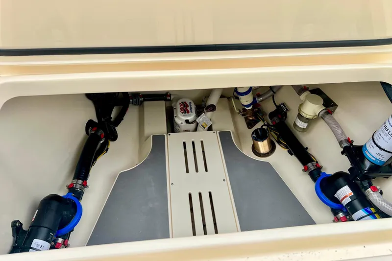 Slide: The Image of Engine compartment of 2026 Scout 288 LXF boat, showcasing mechanical components and systems. - 37