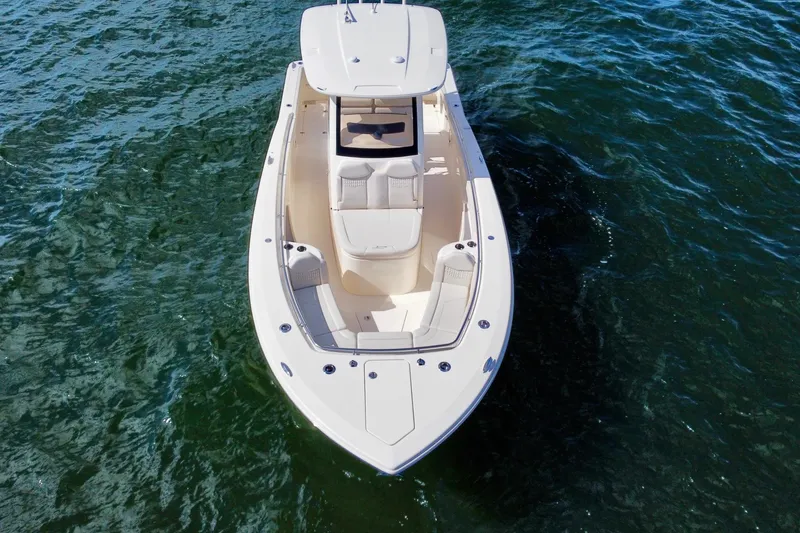 Slide: The Image of 2026 Scout 288 LXF boat on open water, aerial view. - 4