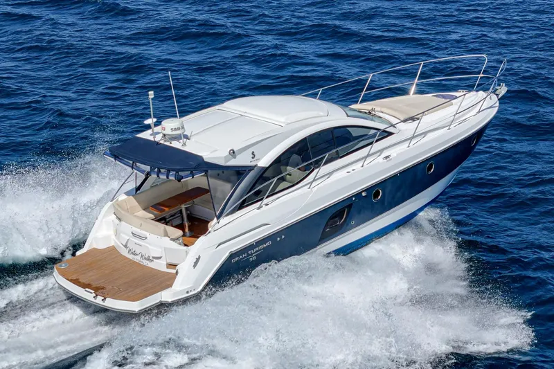 Slide: The Image of 2014 Beneteau Gran Turismo 38 yacht cruising on open sea. - 11