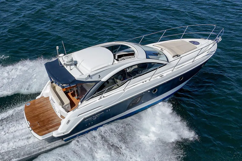 Slide: The Image of 2014 Beneteau Gran Turismo 38 yacht cruising on open water. - 12